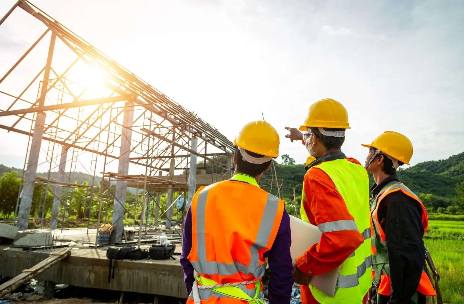 Project team reviewing progress on a building frame